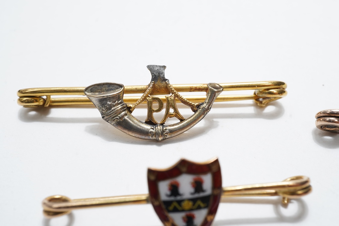 Four sweetheart type brooches; a hallmarked 9ct gold example with an enamel coat of arms, together with three yellow metal military brooches; all Prince Albert’s Somerset Light Infantry, two with enamelled ‘Jellalabad PA